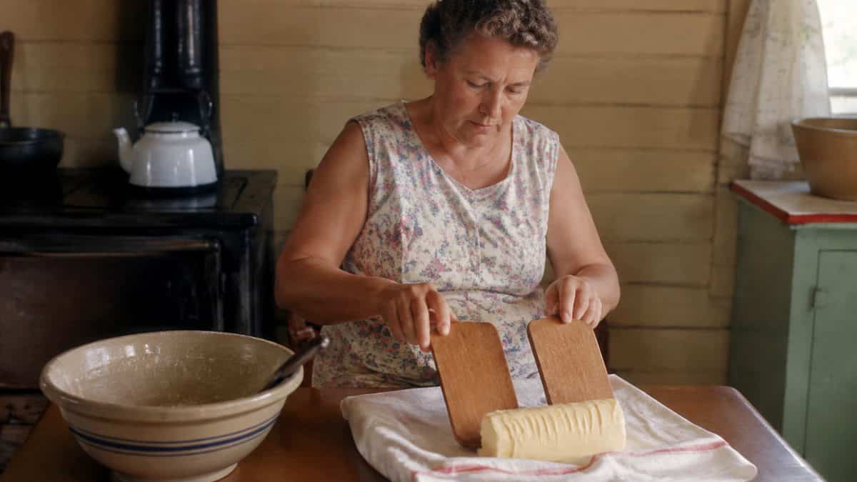 15 Basic Life Hacks from Grandma That Still Beat Modern Solutions 16 Real photograph of someone using wooden butter paddles to shape homemade butter.