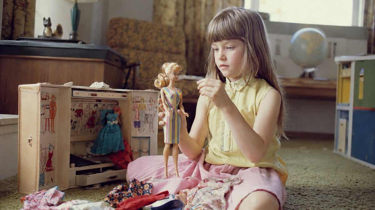 Child with a 1960s Barbie