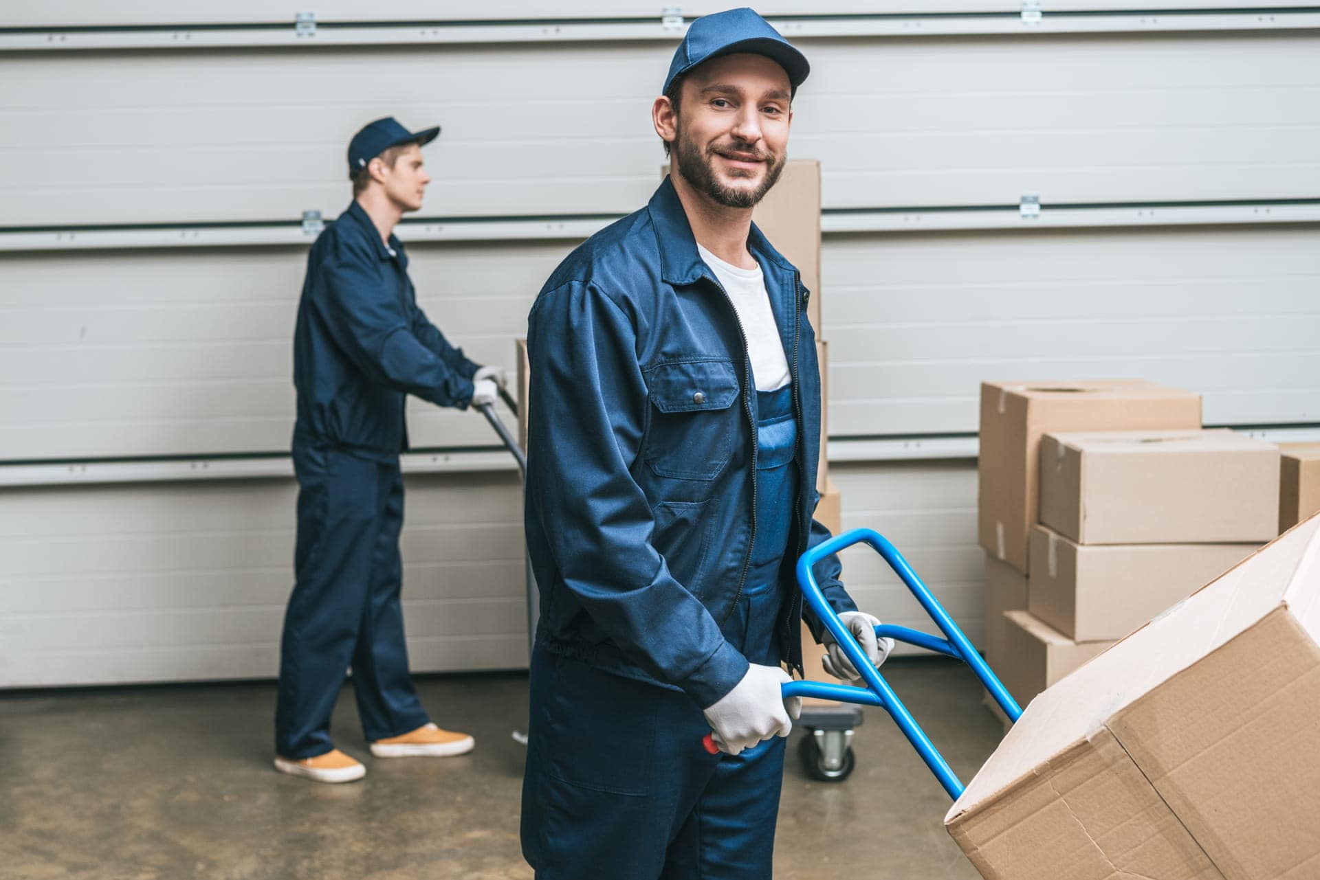 moving company-movers-in-uniform-transporting--boxes