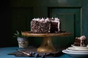 cake on a platter in a kitchen