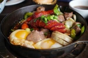 a cast iron being used to cook