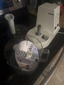 a food processor sitting on a stove