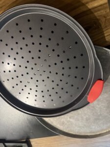 pizza pans on counter