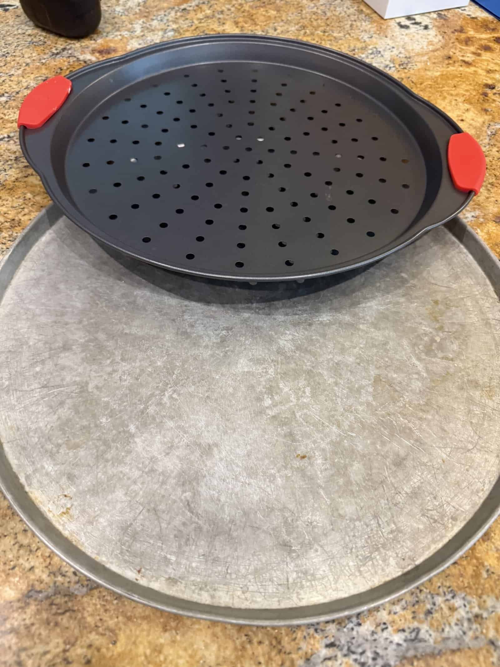 Best Pizza Pans and Crisper Trays in 2026: Perforated, Solid, and Stone Picks