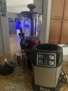 a portable blender next to full size blender in kitchen