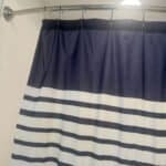 How to Stop a Shower Curtain From Blowing In: Air Pressure, Weights, and Curved Rods