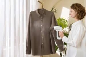 a clothing steamer working on a shirt