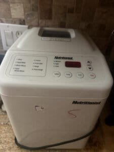 a bread machine on a countertop for home baking