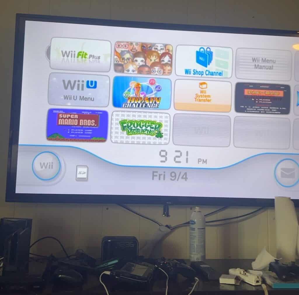 TV screen showing Wii U menu and game icons at Redcypress Designs.