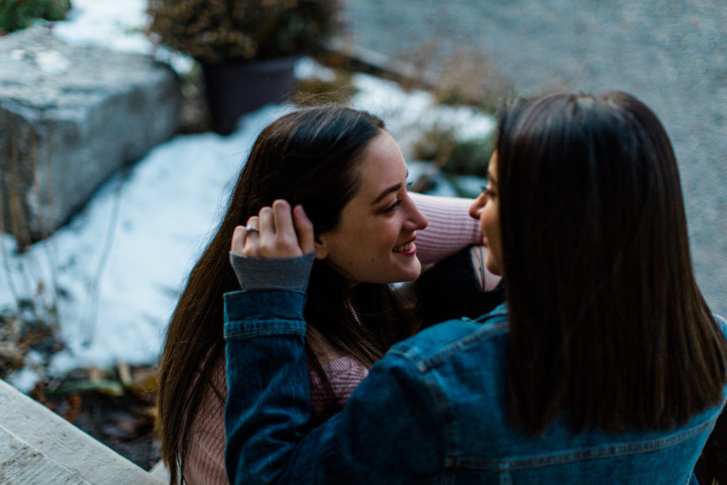 same gender couple female gay couple kissing outside intimate same sex engagement session tips grey loft studio ottawa wedding photographer ottawa wedding videographer wedding photo affordable wedding photographer cheap wedding photographer budget photographer kanata wedding photographer 