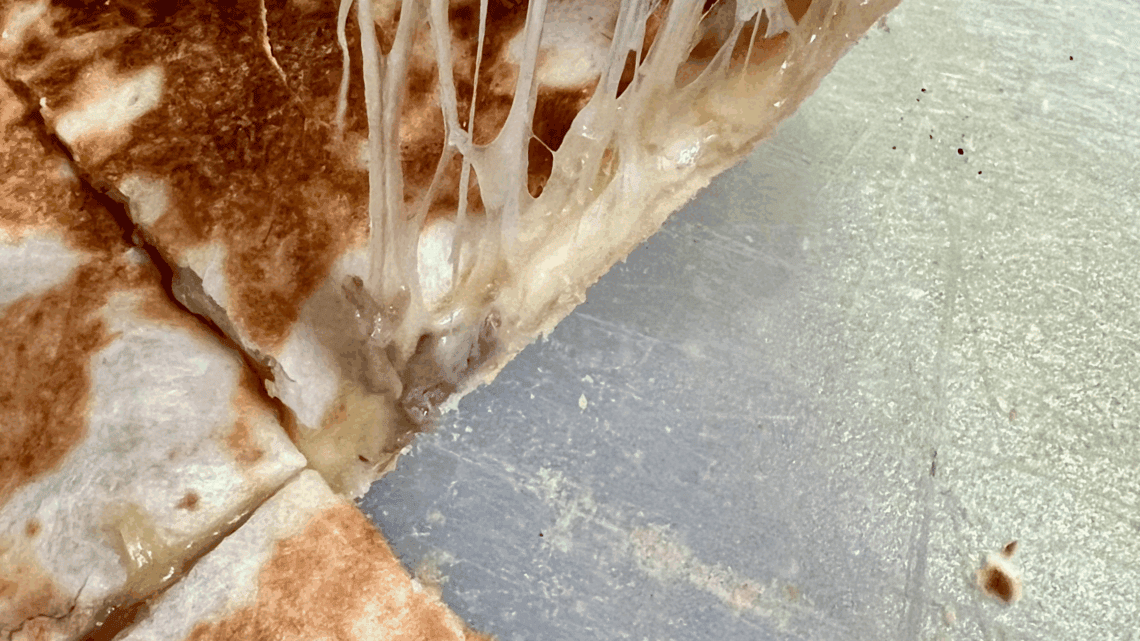 Delicious grilled cheese sandwich melting with gooey cheese on a griddler, perfect for a lazy lunch.