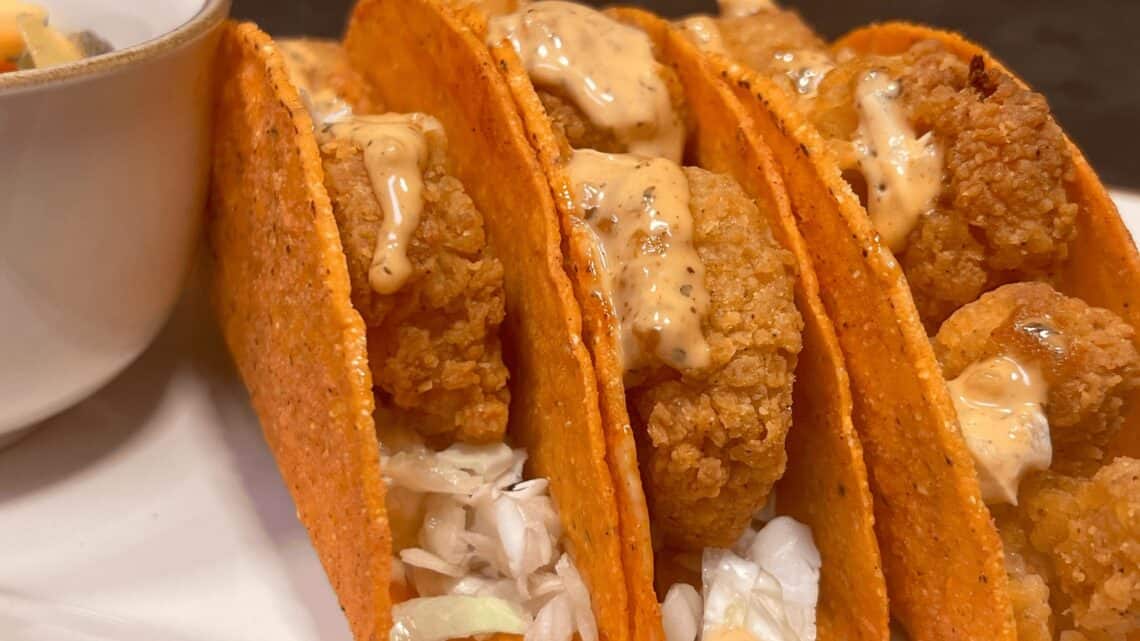 Delicious crispy shrimp tacos with spicy sauce, perfect for Girl Dinner.