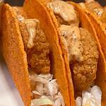 Delicious crispy shrimp tacos with spicy sauce, perfect for Girl Dinner.