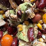 Colorful smoky chicken and bean salad with corn and avocado, vibrant and fresh.