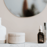 Skincare products on a bathroom counter, including serums and creams, ideal for FSA spending.