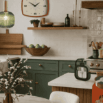 Cozy kitchen with green cabinets, white countertops, and decorative accents.