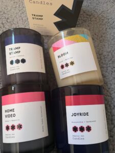 Vibrant candles from Regular Ass Candles featuring unique scents and stylish packaging, perfect for e.