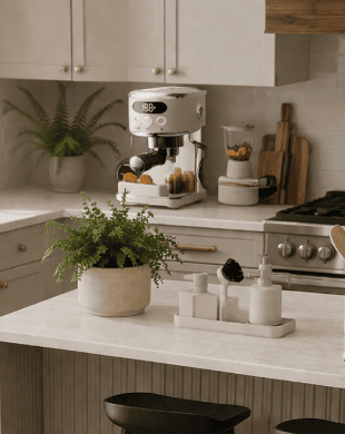 Bright kitchen featuring green cabinets, wooden shelves, and a cozy dining area with a round table a.