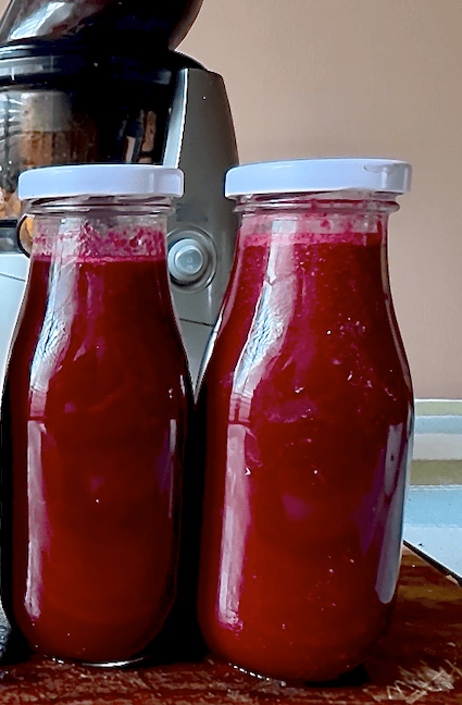 Fresh homemade juice in glass bottles for healthy living.