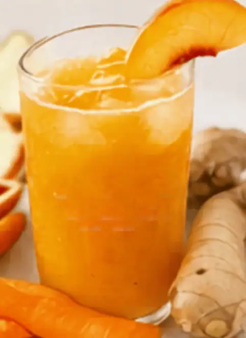 Refreshing ginger and orange juice with a slice of orange garnish.
