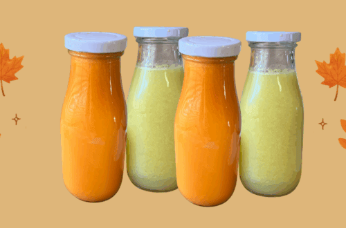 Fresh fall juice bottles with orange and green smoothies for cozy season.