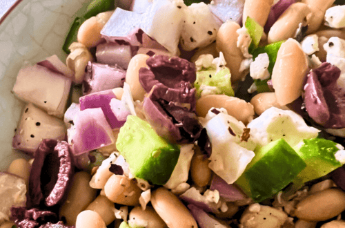 Colorful Mediterranean bean salad with vegetables and beans close-up.