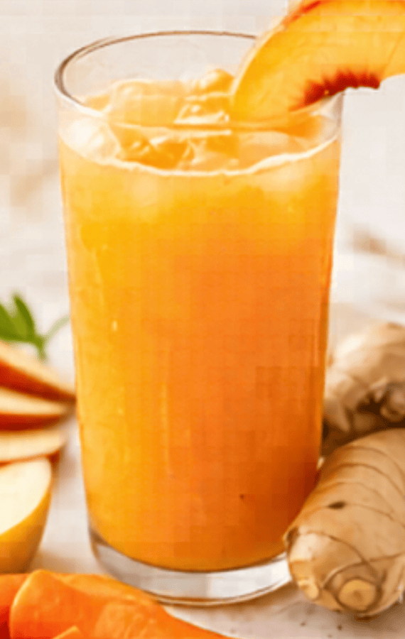 Glass of fresh ginger peach juice garnished with peach slice, ideal for spring and summer refreshmen.