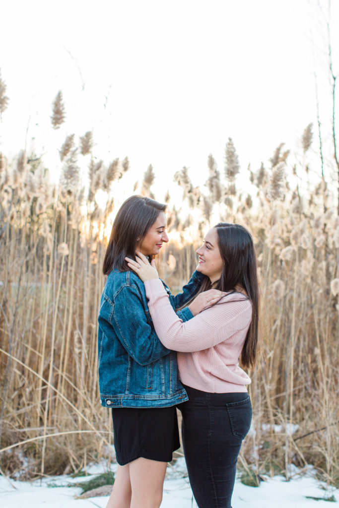 same sex women engagement session looking at each other same gender couple female gay couple kissing outside intimate same sex engagement session tips grey loft studio ottawa wedding photographer ottawa wedding videographer wedding photo affordable wedding photographer cheap wedding photographer budget photographer kanata wedding photographer 