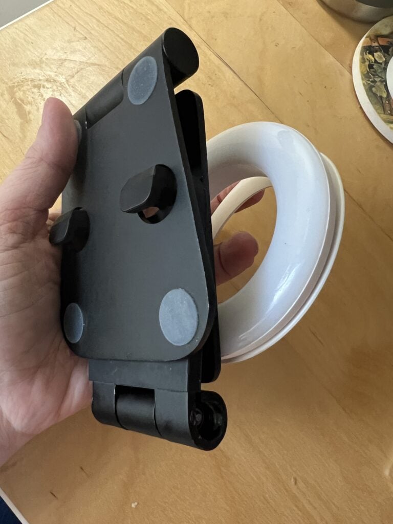 Compact iPhone tripod holder with adjustable grip for easy setup.