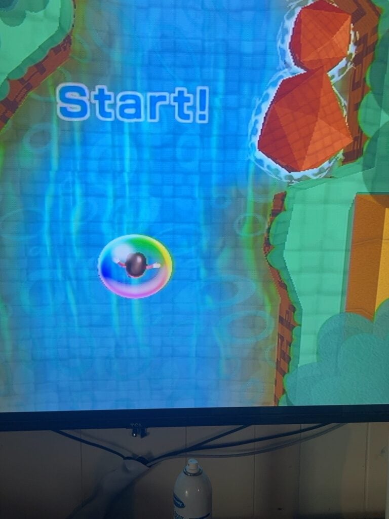 Start button on a vibrant, cartoon-style water race game screen.