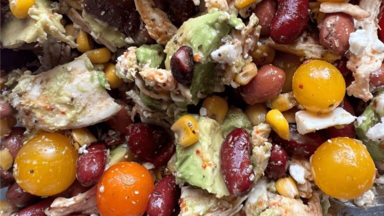 Colorful smoky chicken and bean salad with corn and avocado, vibrant and fresh.