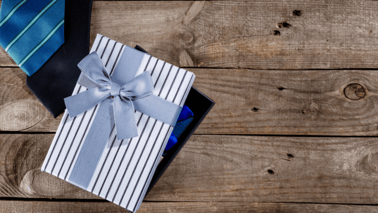 Gift box with tie, watch, and accessories for Father’s Day presents.