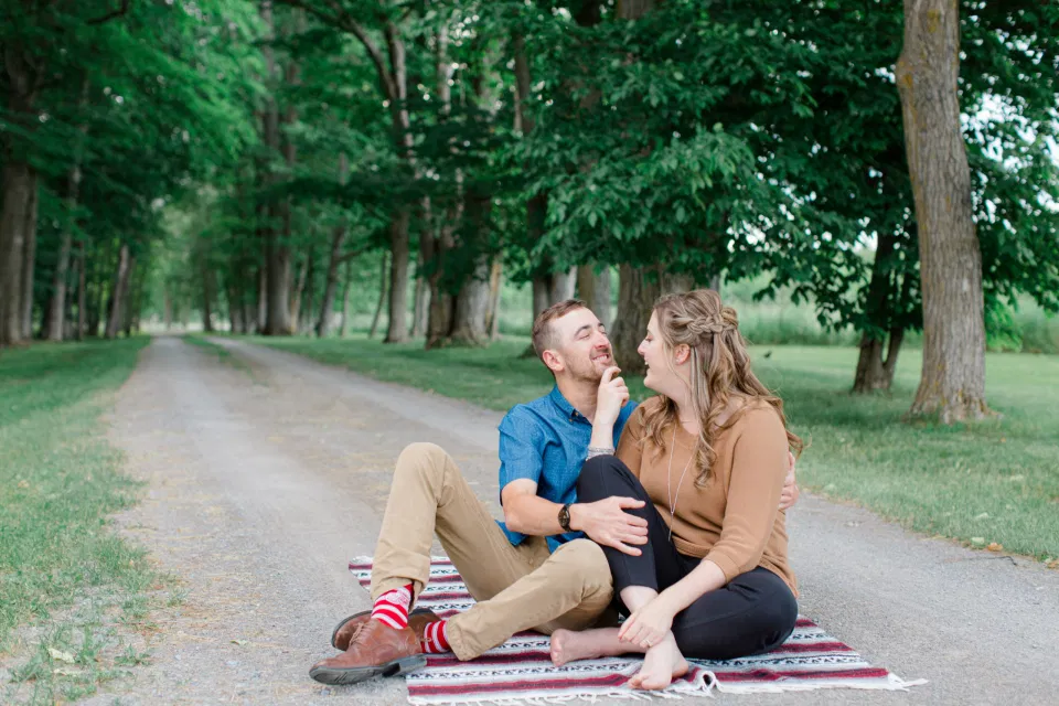 Fun on the Farm - Farm Photo Session - Farm Engagement Session - Blue and Brown Engagement Session Inspiration - Natural Engagement Session Posing - Ideas for what to wear for Engagement Photography, Modern Engagement Session Inspiration Wardrobe Ideas. Unsure of what to wear for your engagement photos, we've got you! Romantic brown with black leggings for Summer Engagement in Almonte. Grey Loft Studio is Ottawa's Wedding and Engagement Photographer for Real couples, showcasing photos that are modern, bright, and fun.