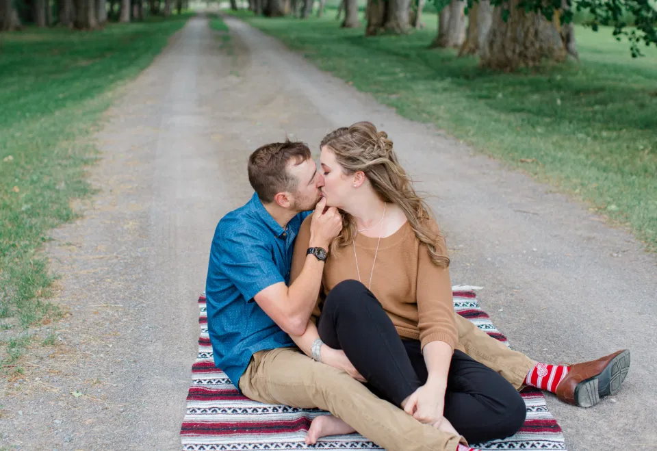 Easy posing Inspiration - Fun on the Farm - Farm Engagement Session - Blue and Brown Engagement Session Inspiration - Natural Engagement Session Posing - Ideas for what to wear for Engagement Photography, Modern Engagement Session Inspiration Wardrobe Ideas. Unsure of what to wear for your engagement photos, we've got you! Romantic brown with black leggings for Summer Engagement in Almonte. Grey Loft Studio is Ottawa's Wedding and Engagement Photographer for Real couples, showcasing photos that are modern, bright, and fun.
