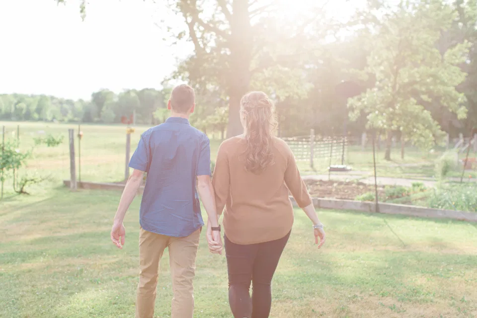 Farm Engagement Session - Blue and Brown Engagement Session Inspiration - Natural Engagement Session Posing - Ideas for what to wear for Engagement Photography, Modern Engagement Session Inspiration Wardrobe Ideas. Unsure of what to wear for your engagement photos, we've got you! Romantic brown with black leggings for Summer Engagement in Almonte. Grey Loft Studio is Ottawa's Wedding and Engagement Photographer for Real couples, showcasing photos that are modern, bright, and fun.