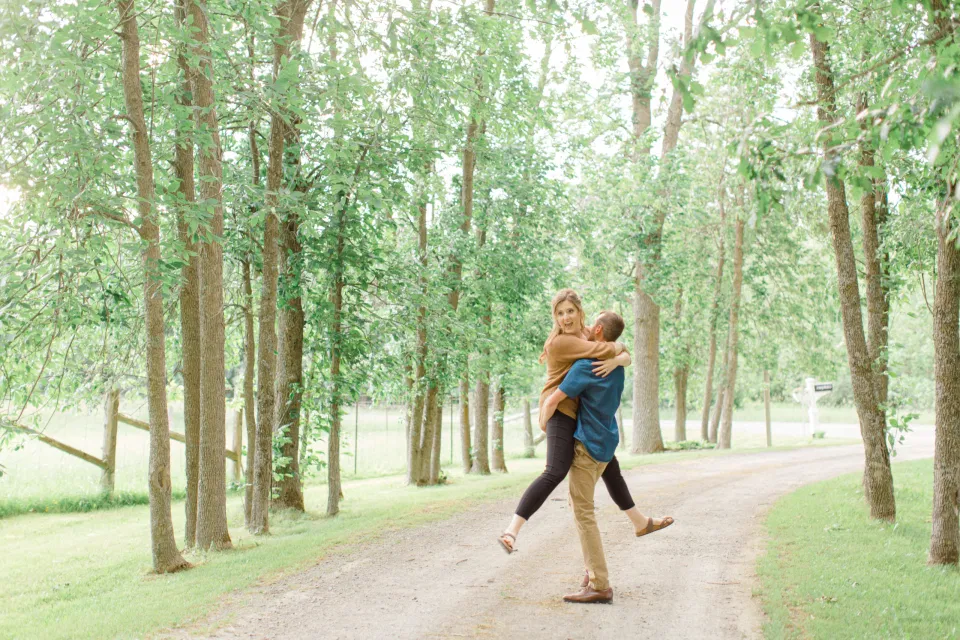 Frolic - Natural Posing for Photo Session - Couples Photo Session Fun - Fun on the Farm - Farm Engagement Session - Blue and Brown Engagement Session Inspiration - Natural Engagement Session Posing - Ideas for what to wear for Engagement Photography, Modern Engagement Session Inspiration Wardrobe Ideas. Unsure of what to wear for your engagement photos, we've got you! Romantic brown with black leggings for Summer Engagement in Almonte. Grey Loft Studio is Ottawa's Wedding and Engagement Photographer for Real couples, showcasing photos that are modern, bright, and fun.