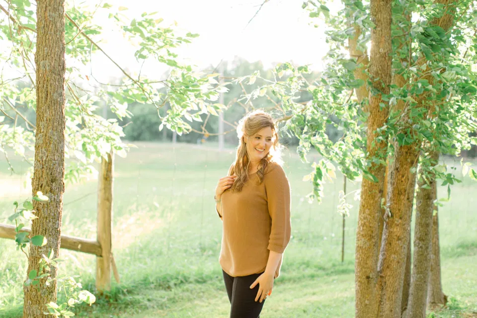 Single Photo  - Natural Posing for Photo Session - Couples Photo Session Fun - Fun on the Farm - Farm Engagement Session - Blue and Brown Engagement Session Inspiration - Natural Engagement Session Posing - Ideas for what to wear for Engagement Photography, Modern Engagement Session Inspiration Wardrobe Ideas. Unsure of what to wear for your engagement photos, we've got you! Romantic brown with black leggings for Summer Engagement in Almonte. Grey Loft Studio is Ottawa's Wedding and Engagement Photographer for Real couples, showcasing photos that are modern, bright, and fun.