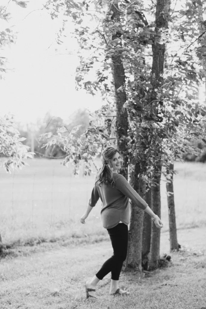 Natural Posing for Photo Session - Couples Photo Session Fun - Fun on the Farm - Farm Engagement Session - Blue and Brown Engagement Session Inspiration - Natural Engagement Session Posing - Ideas for what to wear for Engagement Photography, Modern Engagement Session Inspiration Wardrobe Ideas. Unsure of what to wear for your engagement photos, we've got you! Romantic brown with black leggings for Summer Engagement in Almonte. Grey Loft Studio is Ottawa's Wedding and Engagement Photographer for Real couples, showcasing photos that are modern, bright, and fun.