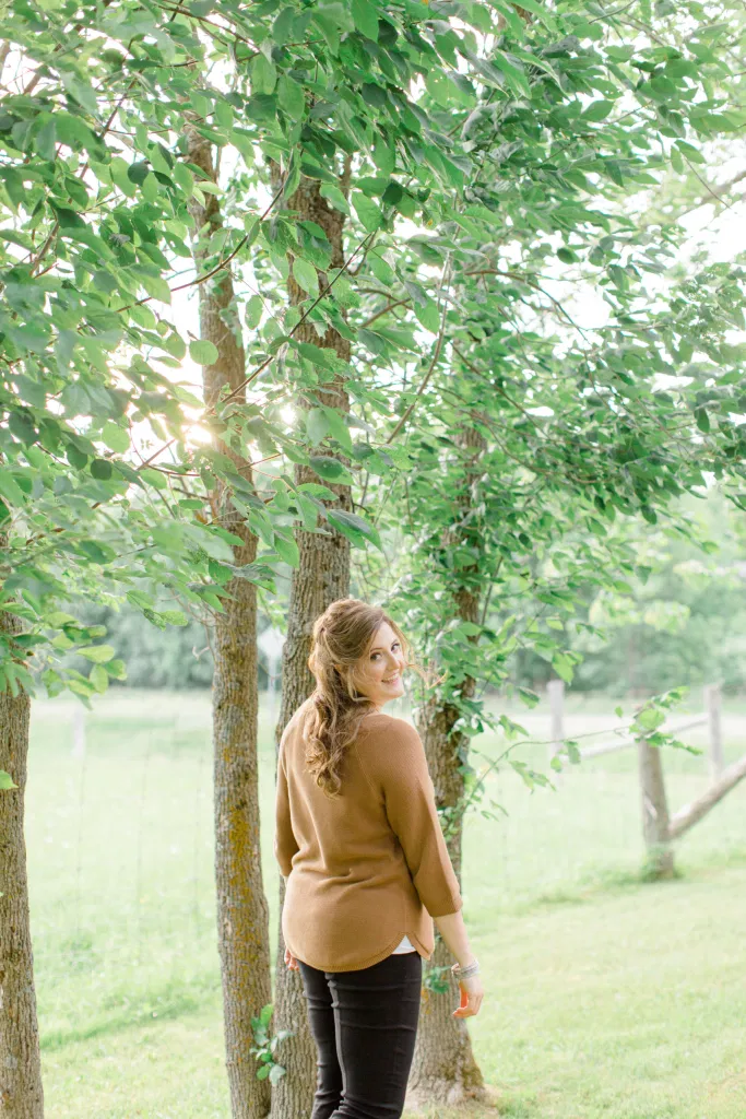 Natural Posing for Photo Session - Couples Photo Session Fun - Fun on the Farm - Farm Engagement Session - Blue and Brown Engagement Session Inspiration - Natural Engagement Session Posing - Ideas for what to wear for Engagement Photography, Modern Engagement Session Inspiration Wardrobe Ideas. Unsure of what to wear for your engagement photos, we've got you! Romantic brown with black leggings for Summer Engagement in Almonte. Grey Loft Studio is Ottawa's Wedding and Engagement Photographer for Real couples, showcasing photos that are modern, bright, and fun.