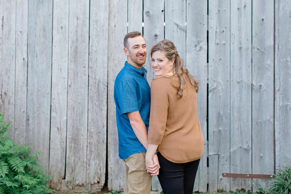Blue and Brown Engagement Session Inspiration - Natural Engagement Session Posing - Ideas for what to wear for Engagement Photography, Modern Engagement Session Inspiration Wardrobe Ideas. Unsure of what to wear for your engagement photos, we've got you! Romantic brown with black leggings for Summer Engagement in Almonte. Grey Loft Studio is Ottawa's Wedding and Engagement Photographer for Real couples, showcasing photos that are modern, bright, and fun.