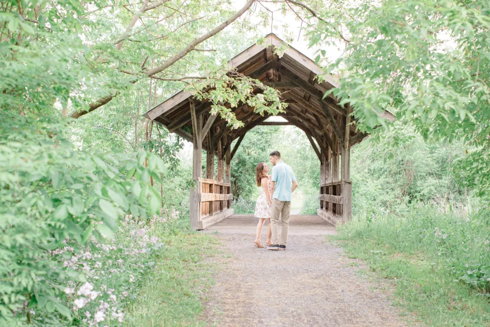Beautiful Engagement Session Inspo. Ideas for what to wear for Engagement Photography, Modern Engagement Session Inspiration Wardrobe Ideas. Unsure of what to wear for your engagement photos, we've got you! Romantic white with Pink Flower dress for Spring Engagement in Ottawa. Grey Loft Studio is Ottawa's Wedding and Engagement Photographer for Real couples, showcasing photos that are modern, bright, and fun.
