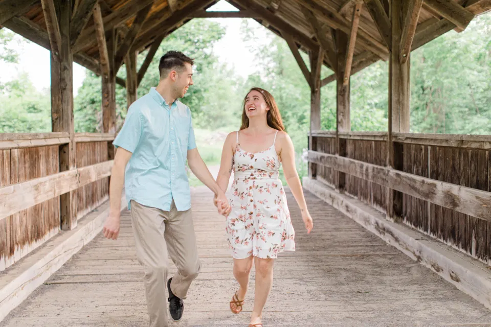 Ideas for what to wear for Engagement Photography, Modern Engagement Session Inspiration Wardrobe Ideas. Unsure of what to wear for your engagement photos, we've got you! Romantic white with Pink Flower dress for Spring Engagement in Ottawa. Grey Loft Studio is Ottawa's Wedding and Engagement Photographer for Real couples, showcasing photos that are modern, bright, and fun.
