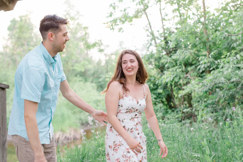 Ideas for what to wear for Engagement Photography, Modern Engagement Session Inspiration Wardrobe Ideas. Unsure of what to wear for your engagement photos, we've got you! Romantic white with Pink Flower dress for Spring Engagement in Ottawa. Grey Loft Studio is Ottawa's Wedding and Engagement Photographer for Real couples, showcasing photos that are modern, bright, and fun.