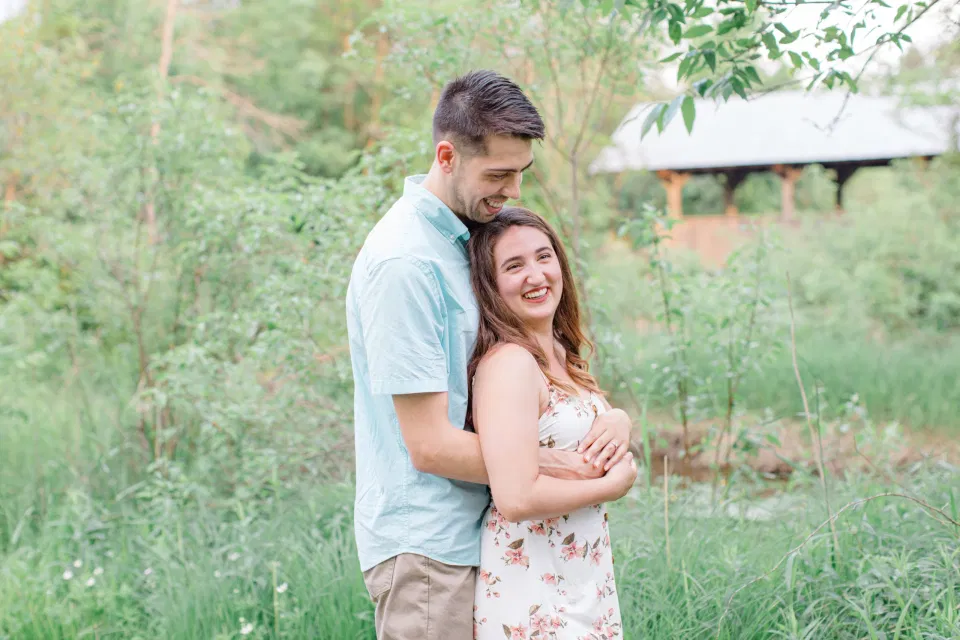 Cute Poses During your Engagement Session - Ideas for what to wear for Engagement Photography, Modern Engagement Session Inspiration Wardrobe Ideas. Unsure of what to wear for your engagement photos, we've got you! Romantic white with Pink Flower dress for Spring Engagement in Ottawa. Grey Loft Studio is Ottawa's Wedding and Engagement Photographer for Real couples, showcasing photos that are modern, bright, and fun.