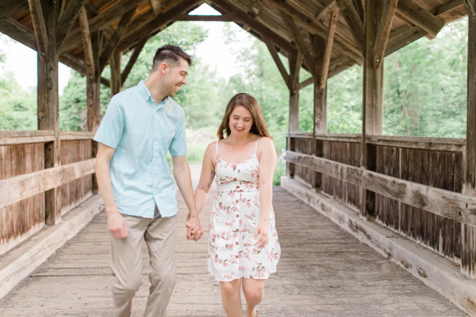 Ideas for what to wear for Engagement Photography, Modern Engagement Session Inspiration Wardrobe Ideas. Unsure of what to wear for your engagement photos, we've got you! Romantic white with Pink Flower dress for Spring Engagement in Ottawa. Grey Loft Studio is Ottawa's Wedding and Engagement Photographer for Real couples, showcasing photos that are modern, bright, and fun.