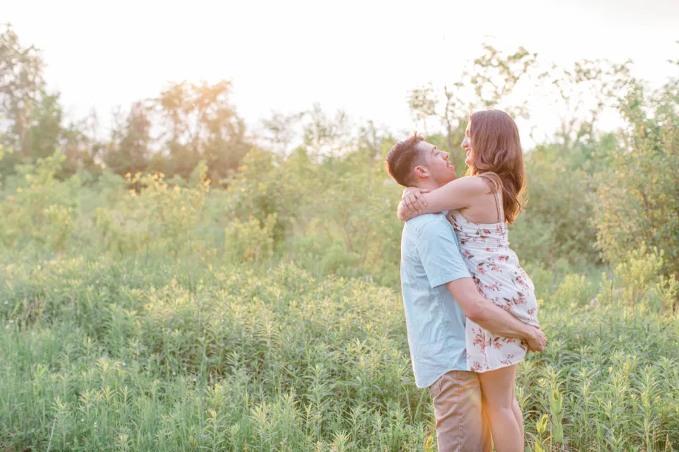 Ideas for what to wear for Engagement Photography, Modern Engagement Session Inspiration Wardrobe Ideas. Unsure of what to wear for your engagement photos, we've got you! Romantic white with Pink Flower dress for Spring Engagement in Ottawa. Grey Loft Studio is Ottawa's Wedding and Engagement Photographer for Real couples, showcasing photos that are modern, bright, and fun.