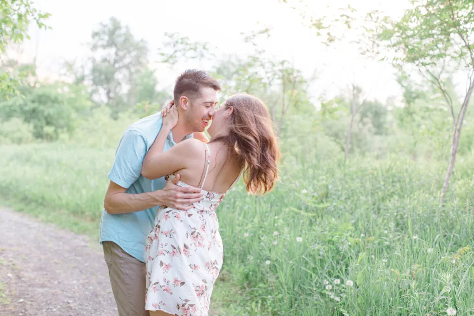 Fun and Love - Ideas for what to wear for Engagement Photography, Modern Engagement Session Inspiration Wardrobe Ideas. Unsure of what to wear for your engagement photos, we've got you! Romantic white with Pink Flower dress for Spring Engagement in Ottawa. Grey Loft Studio is Ottawa's Wedding and Engagement Photographer for Real couples, showcasing photos that are modern, bright, and fun.
