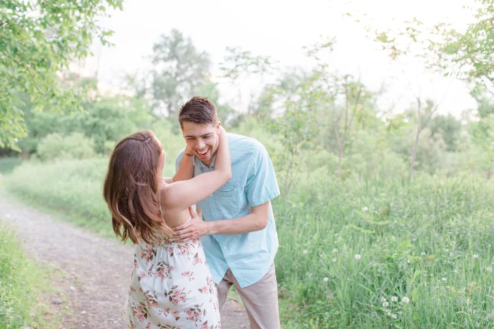 Ideas for what to wear for Engagement Photography, Modern Engagement Session Inspiration Wardrobe Ideas. Unsure of what to wear for your engagement photos, we've got you! Romantic white with Pink Flower dress for Spring Engagement in Ottawa. Grey Loft Studio is Ottawa's Wedding and Engagement Photographer for Real couples, showcasing photos that are modern, bright, and fun.