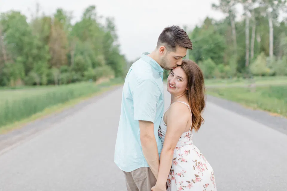 Ideas for what to wear for Engagement Photography, Modern Engagement Session Inspiration Wardrobe Ideas. Unsure of what to wear for your engagement photos, we've got you! Romantic white with Pink Flower dress for Spring Engagement in Ottawa. Grey Loft Studio is Ottawa's Wedding and Engagement Photographer for Real couples, showcasing photos that are modern, bright, and fun.