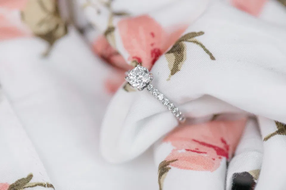 Beautiful Engagement Ring - Posed on Dress - Grey Loft Studio